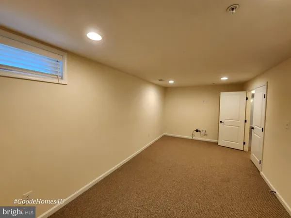 a kitchen with stainless steel appliances granite countertop sink a stove a washer and dryer