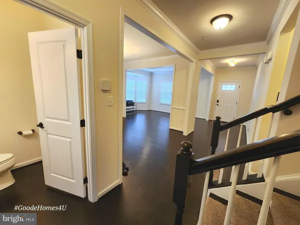 a view of an entryway with wooden floor