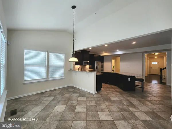 a view of a big room with windows