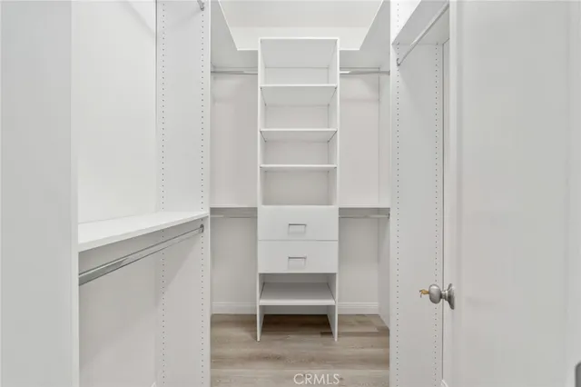 a view of a swimming pool with outdoor seating and plants