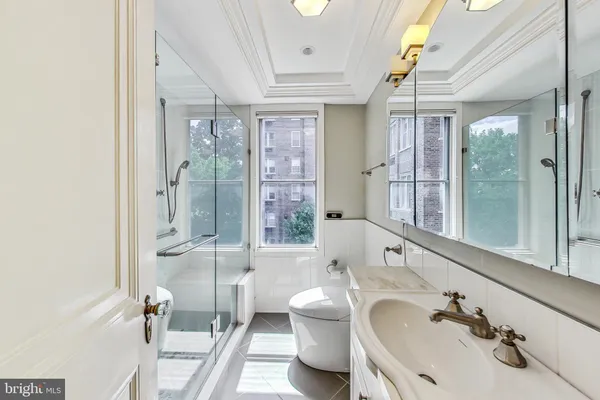 a bathroom with a sink double vanity and a shower