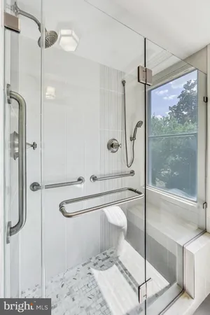 a bathroom with a shower sink and mirror