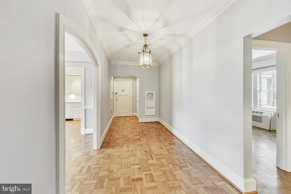 wooden floor in a room with a bathroom