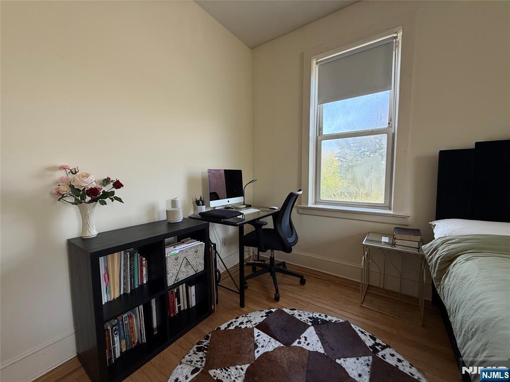 215 Orient Way, Unit C2 Rutherford, NJ 07070 - Photo 18 of 25 a bedroom with a bed and a window