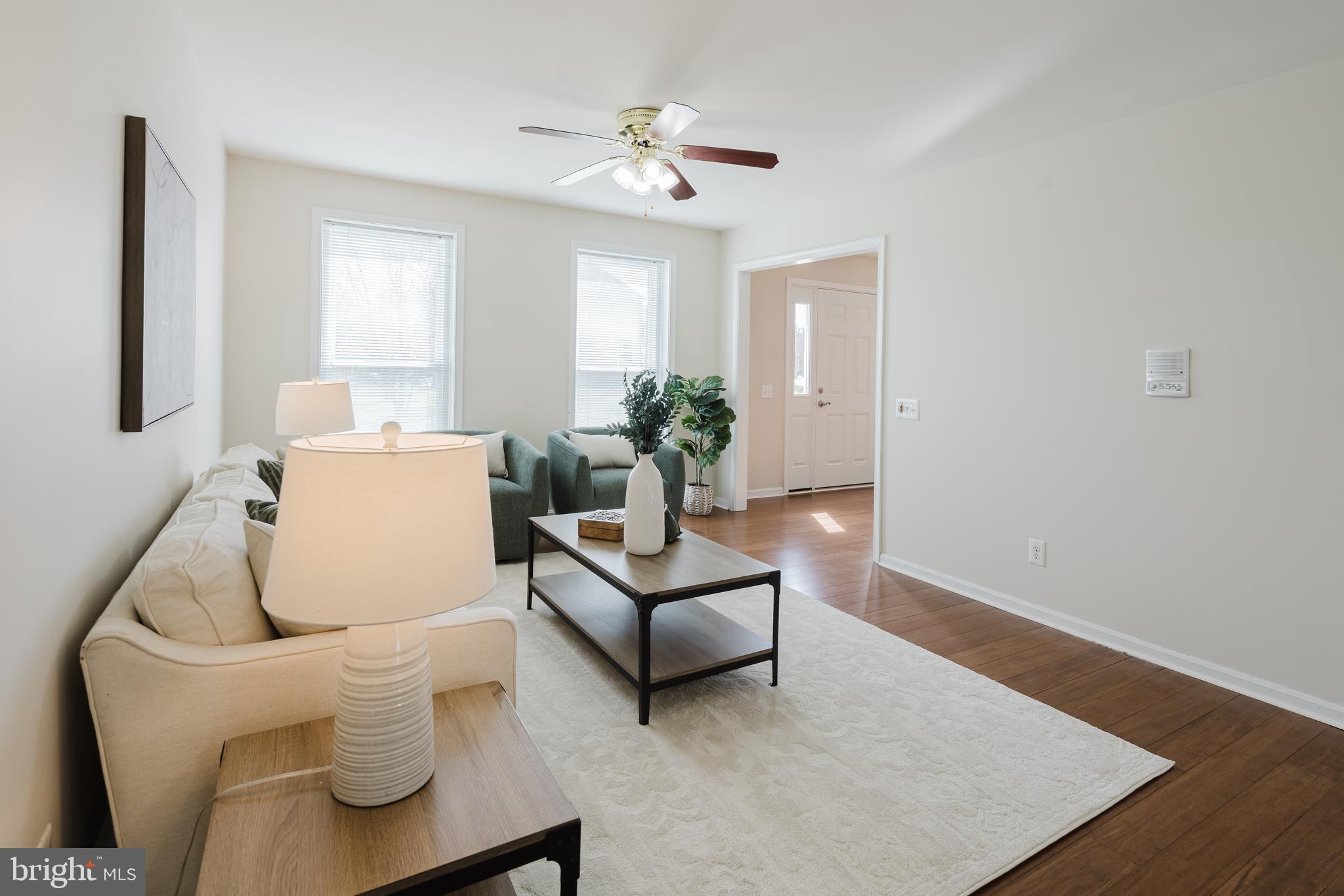 33 Hummingbird Lane Newark, DE 19711 - Photo 12 of 61 a living room with furniture and a large window