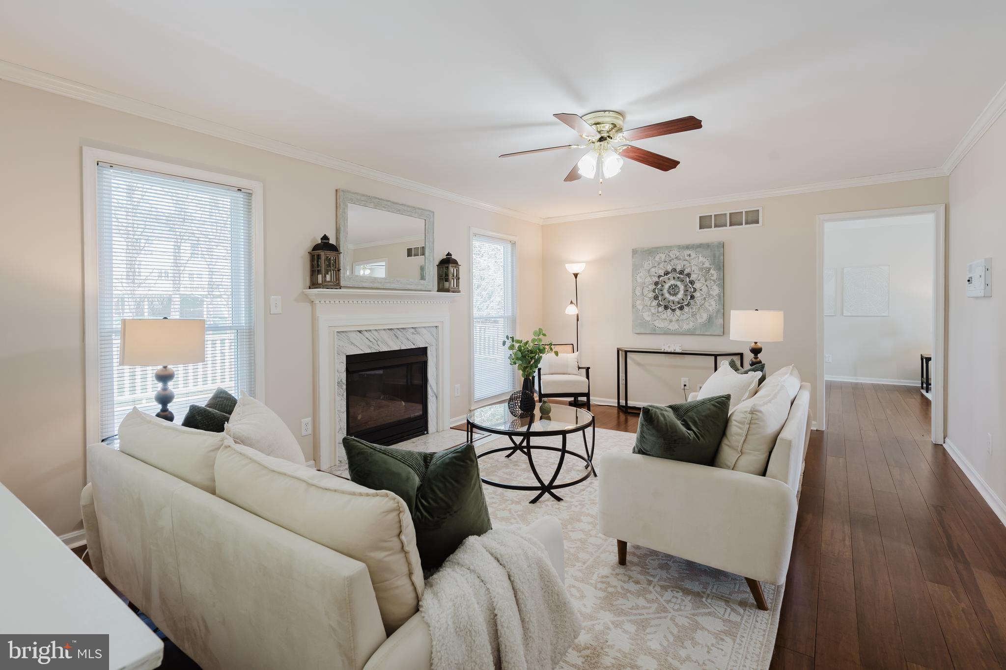 33 Hummingbird Lane Newark, DE 19711 - Photo 19 of 61 a living room with furniture and a fireplace
