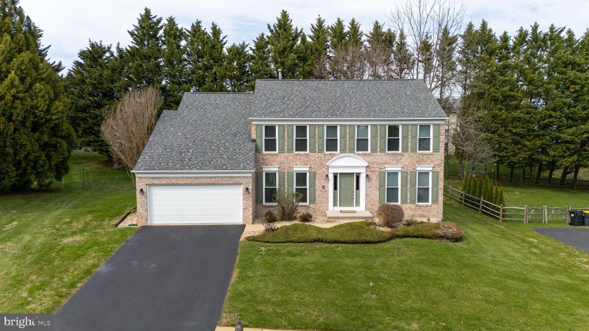 33 Hummingbird Lane Newark, DE 19711 - Photo 2 of 61 a front view of a house with a garden and plants