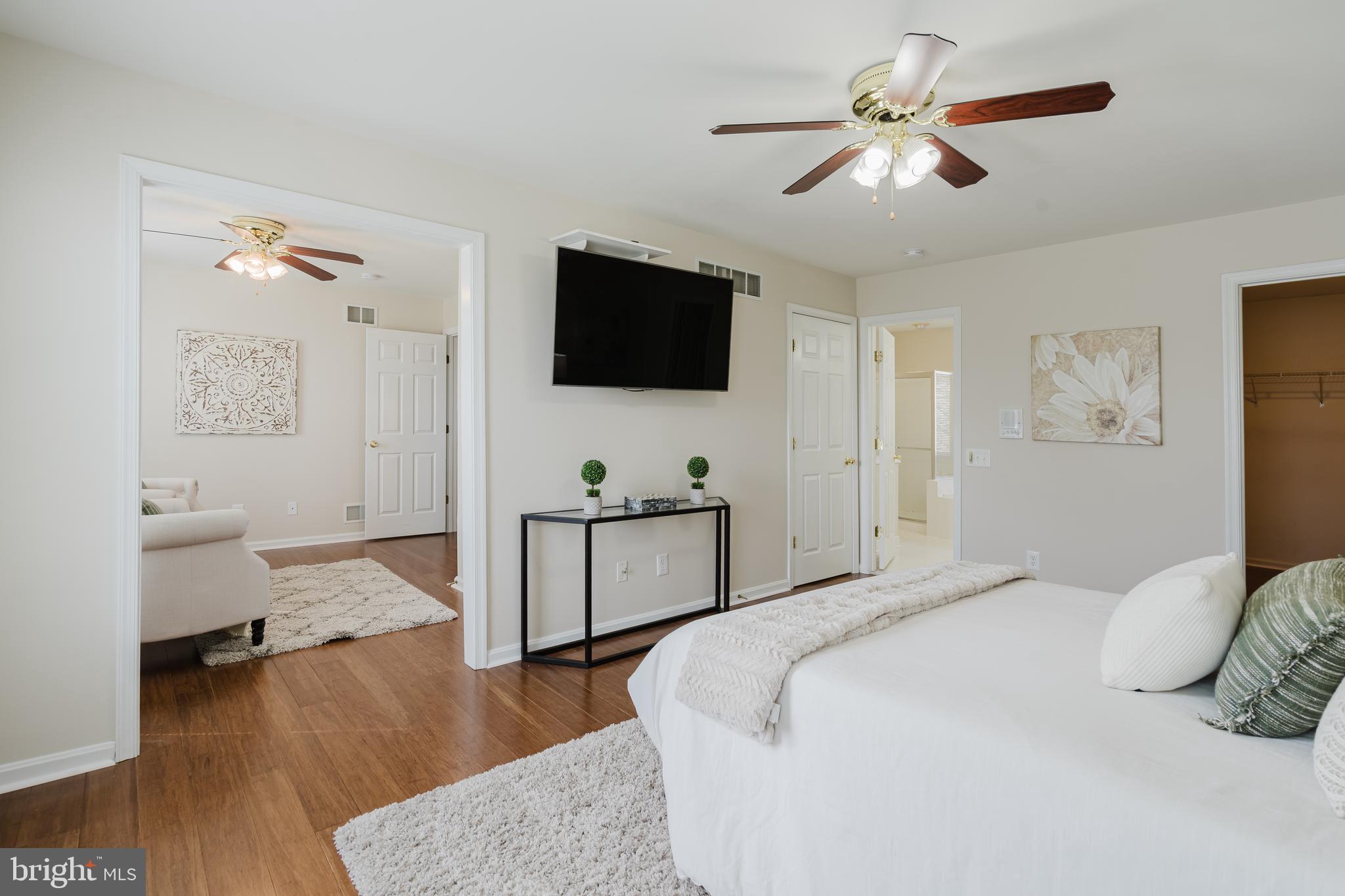 33 Hummingbird Lane Newark, DE 19711 - Photo 28 of 61 a bedroom with a bed and a flat screen tv