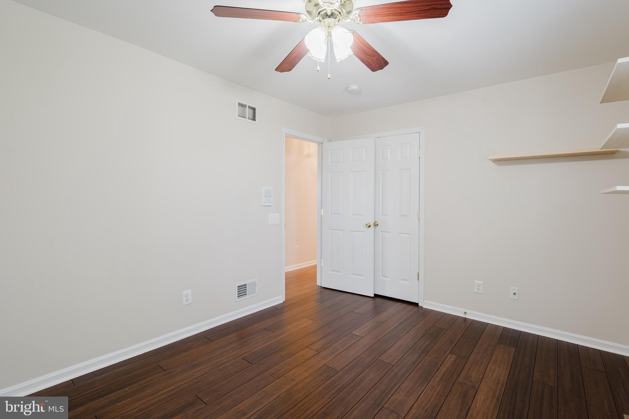 33 Hummingbird Lane Newark, DE 19711 - Photo 37 of 61 a view of an empty room with wooden floor