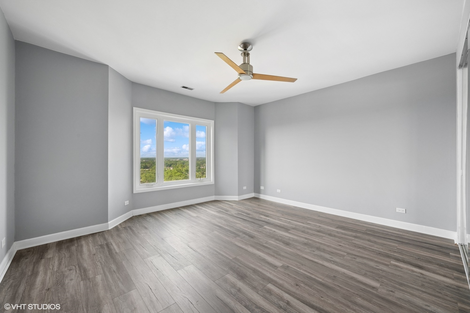 1 Renaissance Place, Unit 3PH Palatine, IL 60067 - Photo 11 of 28 a view of an empty room with wooden floor and a window