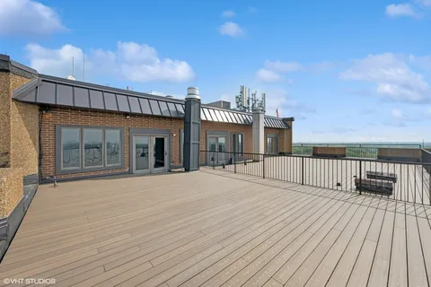 swimming pool with yard and wooden fence