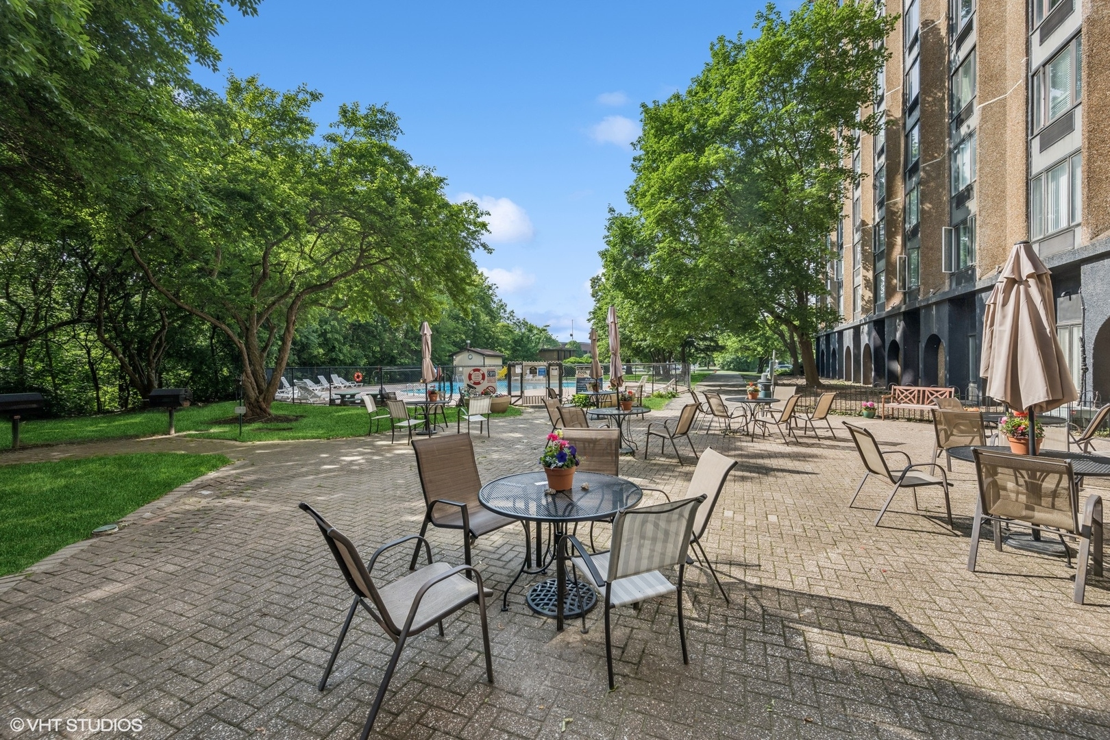 1 Renaissance Place, Unit 3PH Palatine, IL 60067 - Photo 18 of 28 a view of a patio with table and chairs and garden