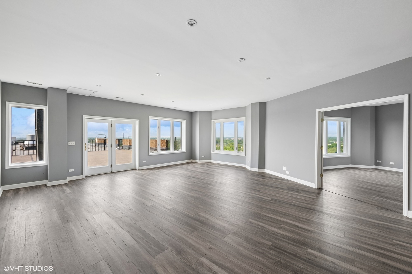 1 Renaissance Place, Unit 3PH Palatine, IL 60067 - Photo 6 of 28 a view of an empty room with wooden floor and a window