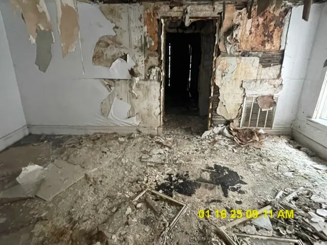 a bathroom with a granite countertop shower and a sink