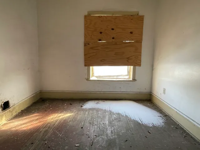 an empty room with windows