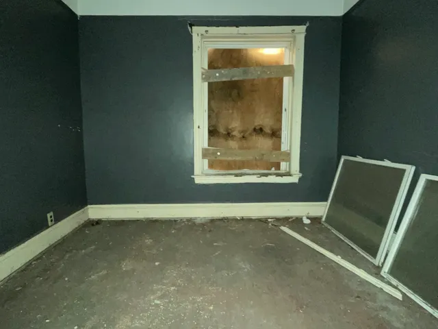 a view of an empty room with a window