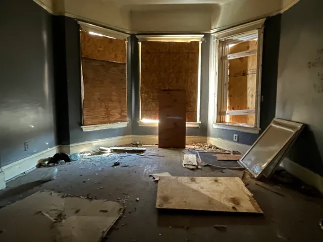 an empty room with a empty space and window