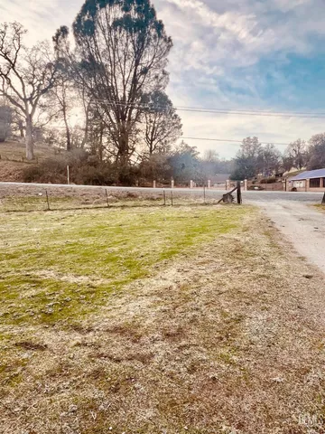 a view of a lake with a yard