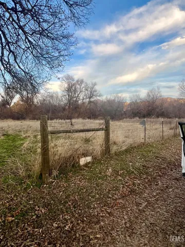 a view of a yard from a balcony