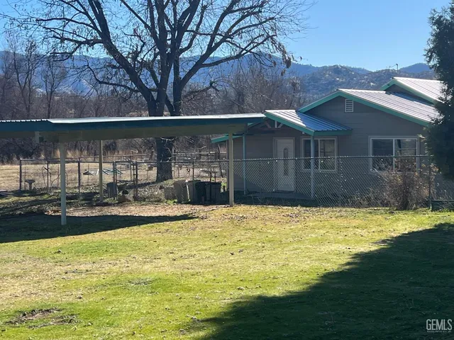 a view of a swimming pool with an outdoor seating