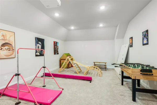 a room with furniture and air hockey table