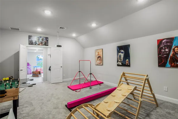 a bedroom with furniture and a wooden floor