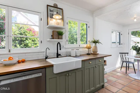 a kitchen with a sink and a window