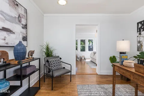 a living room with furniture and a table