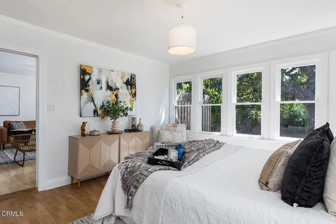 a bedroom with a bed furniture and a window