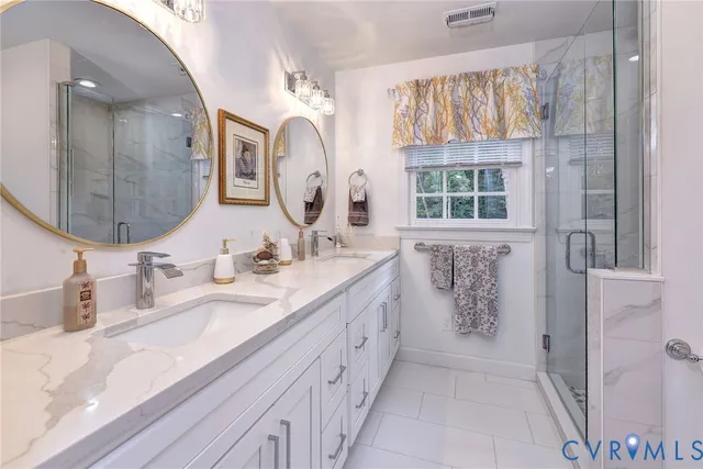 a view of walk in closet with clothes