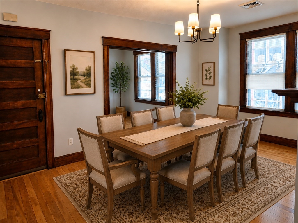 2 Hillside Street, Unit 3 Worcester, MA 01610 - Photo 9 of 30 a view of a dining room with furniture window and wooden floor