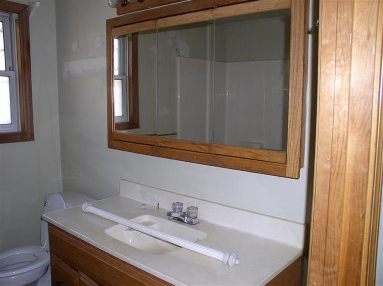 20 Jackbon Road Mashpee, MA 02649 - Photo 18 of 26 a bathroom with a sink and a mirror