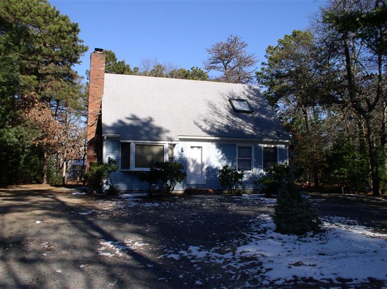 20 Jackbon Road Mashpee, MA 02649 - Photo 2 of 26 a front view of a house with a yard