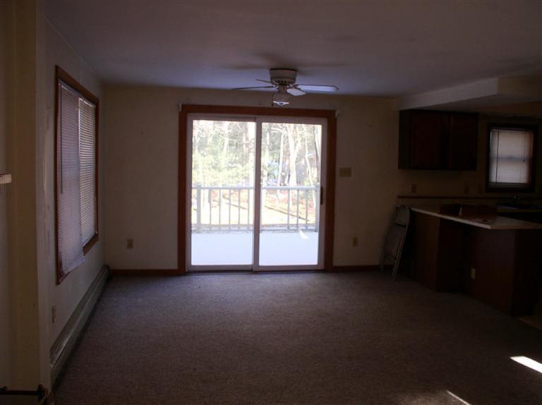 20 Jackbon Road Mashpee, MA 02649 - Photo 8 of 26 a view of empty room with wooden floor and fan