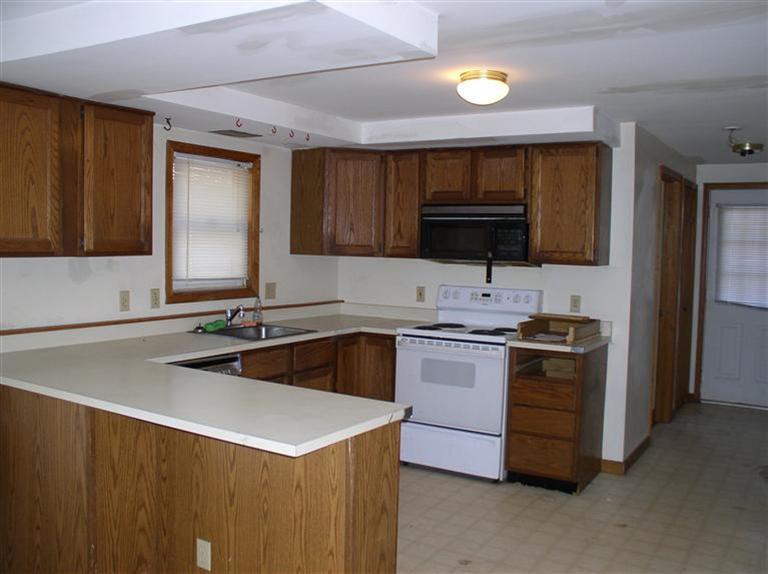 20 Jackbon Road Mashpee, MA 02649 - Photo 9 of 26 a kitchen that has a sink and a stove in it