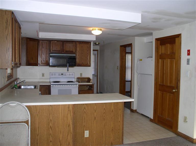 20 Jackbon Road Mashpee, MA 02649 - Photo 10 of 26 a kitchen with stainless steel appliances a refrigerator and a stove top oven