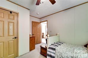 179 Fresh Water Rdg Road Whittier, NC 28789 - Photo 26 of 48 a bedroom with a bed and wooden floor