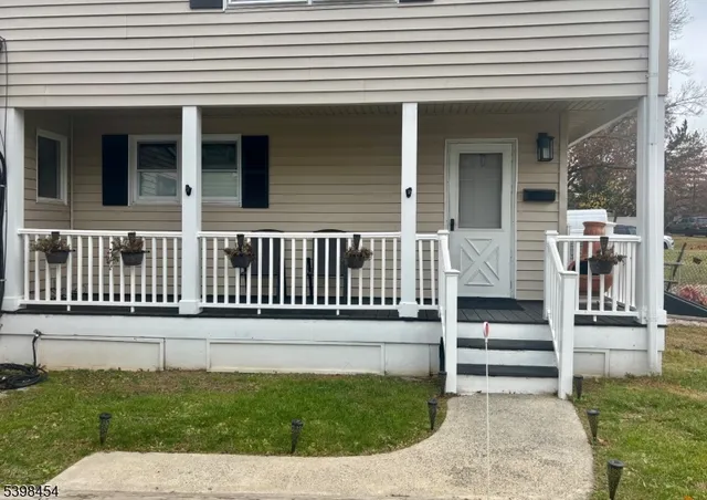 a view of a house with porch and wooden floor