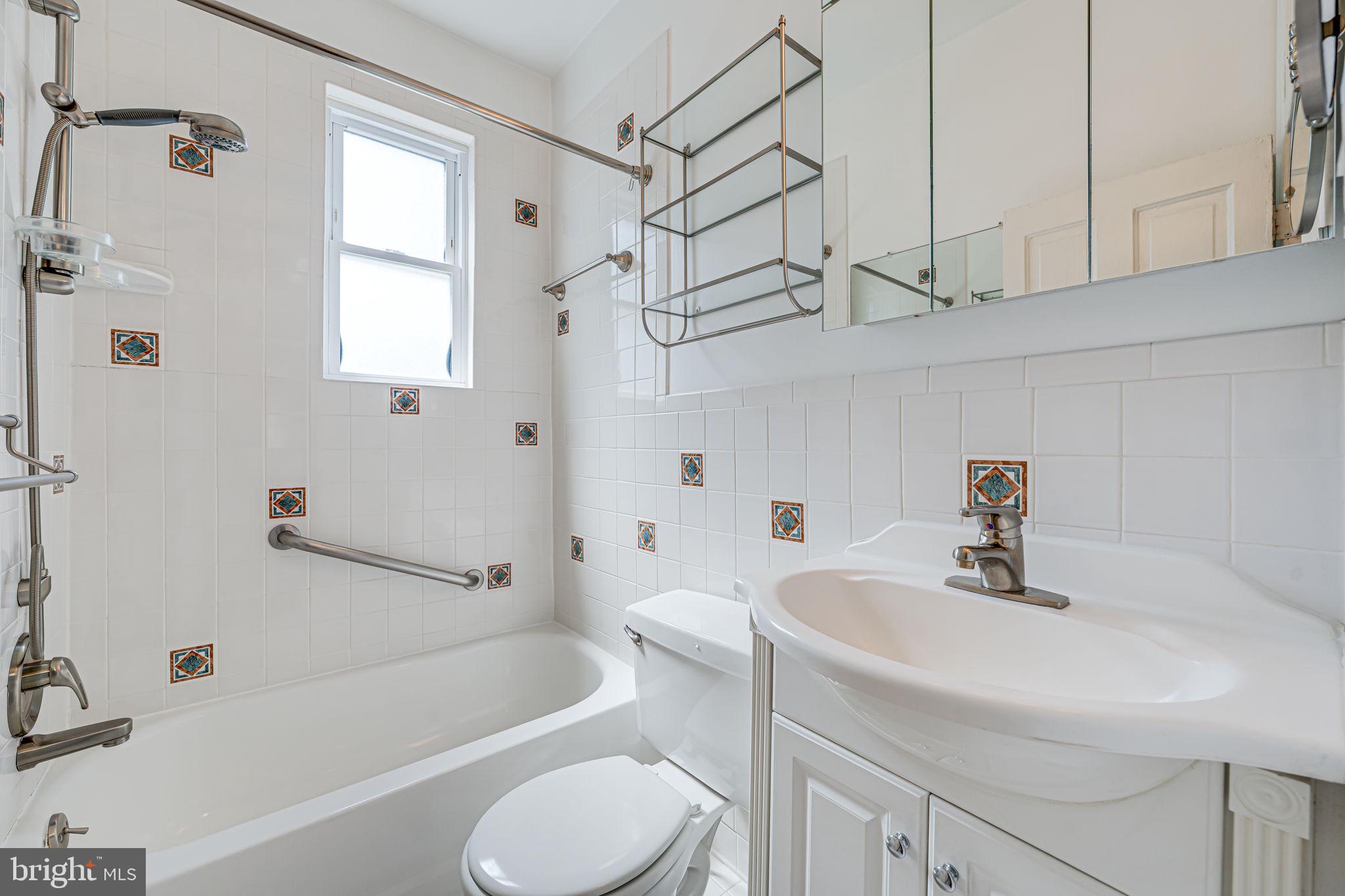 1502 Caroline Street Northwest Washington, DC 20009 - Photo 13 of 22 a bathroom with a sink a toilet and a bathtub