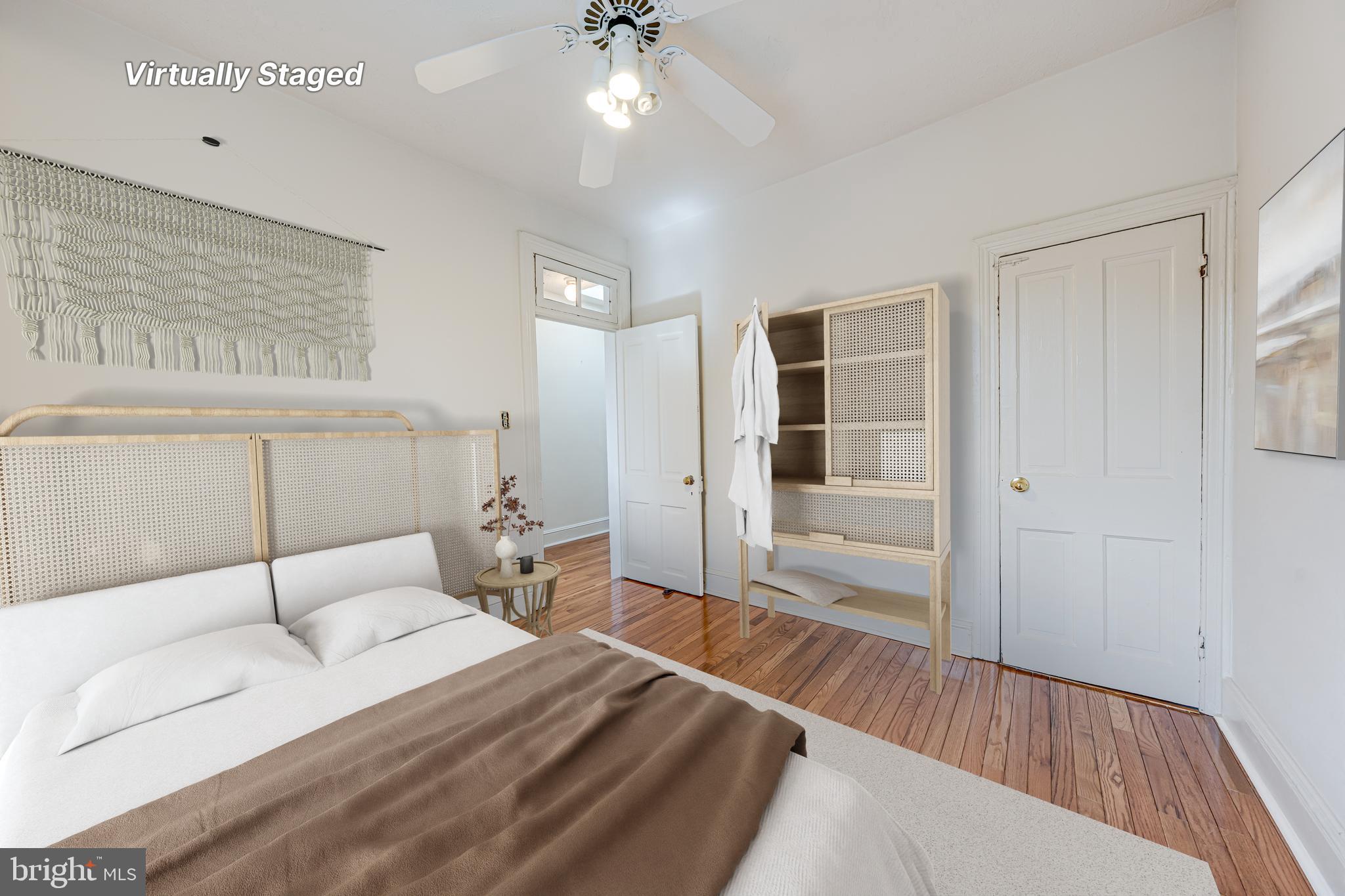 1502 Caroline Street Northwest Washington, DC 20009 - Photo 16 of 22 a bedroom with furniture and a chandelier