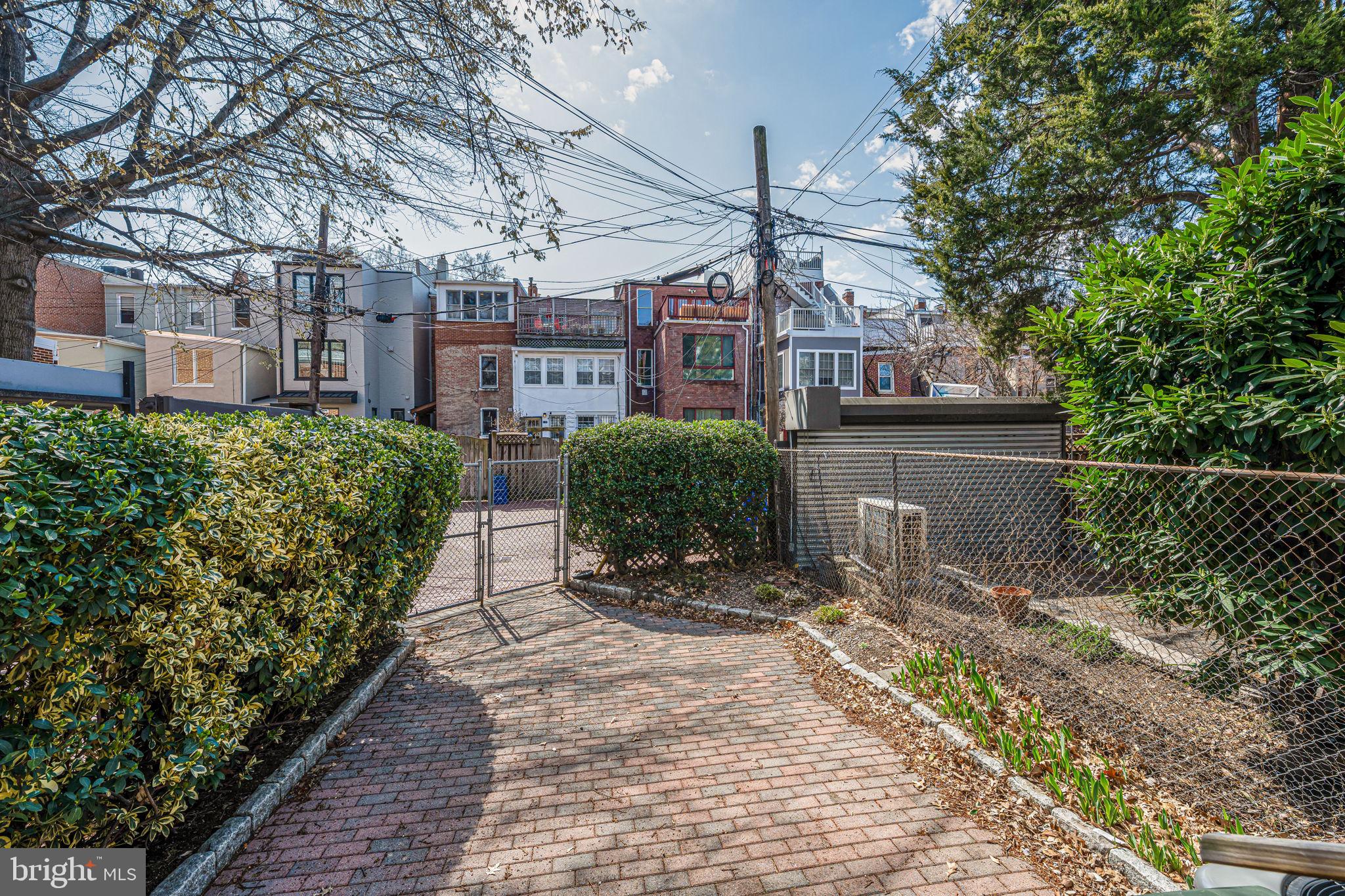 1502 Caroline Street Northwest Washington, DC 20009 - Photo 21 of 22 a front view of a house with a garden