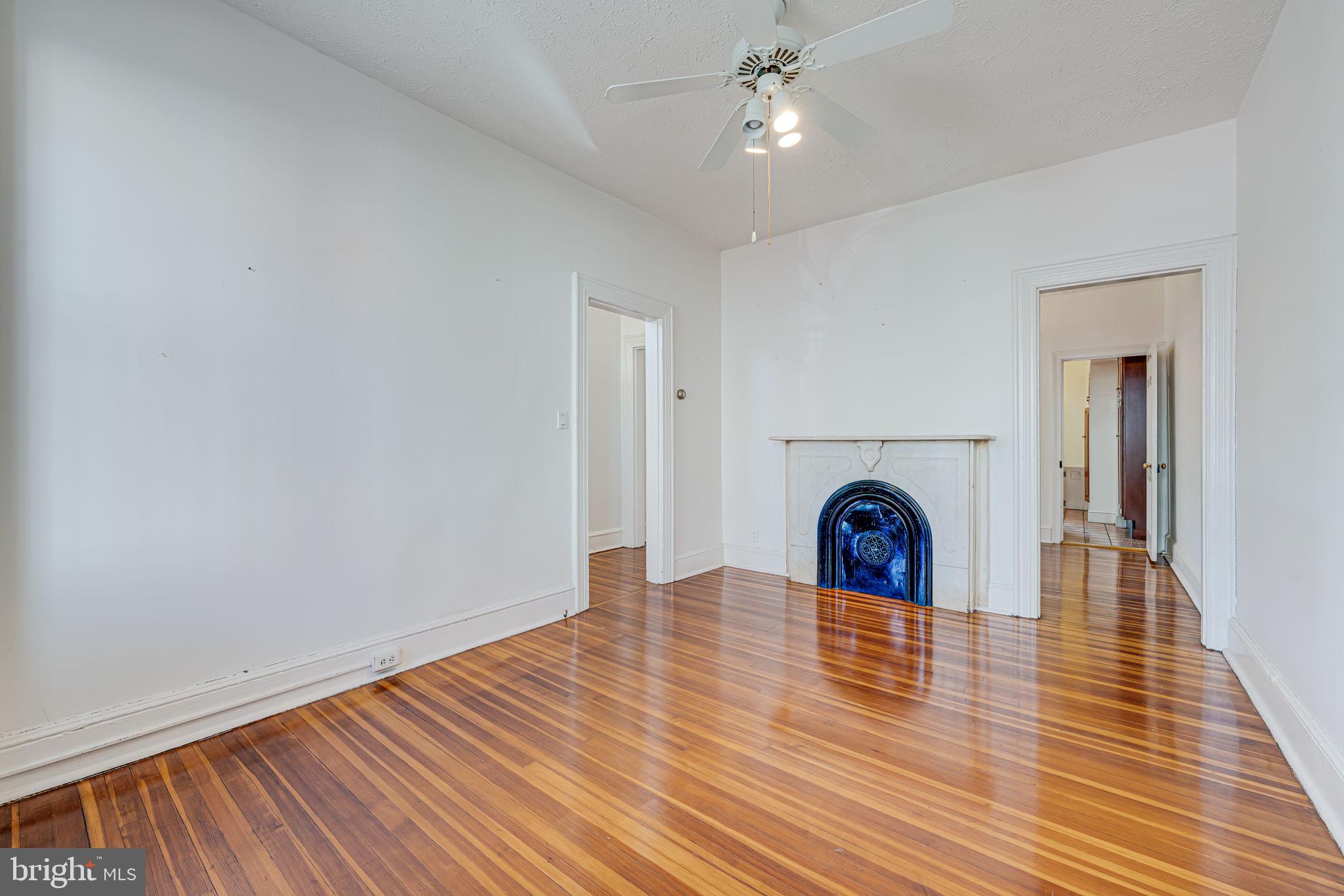 1502 Caroline Street Northwest Washington, DC 20009 - Photo 4 of 22 a view of livingroom with fireplace and wooden floor