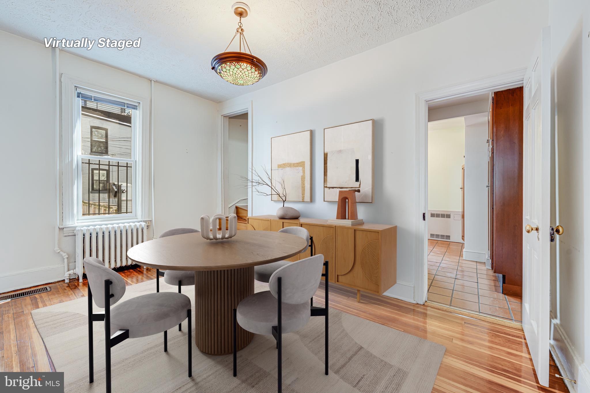 1502 Caroline Street Northwest Washington, DC 20009 - Photo 5 of 22 a view of a dining room with furniture and wooden floor