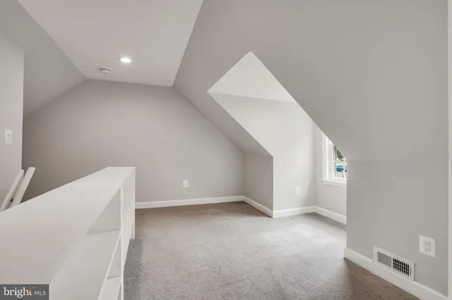 a view of an empty room with a windows