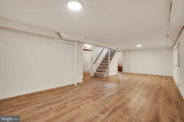 wooden floor in an empty room with stairs