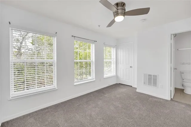 a view of empty room with windows