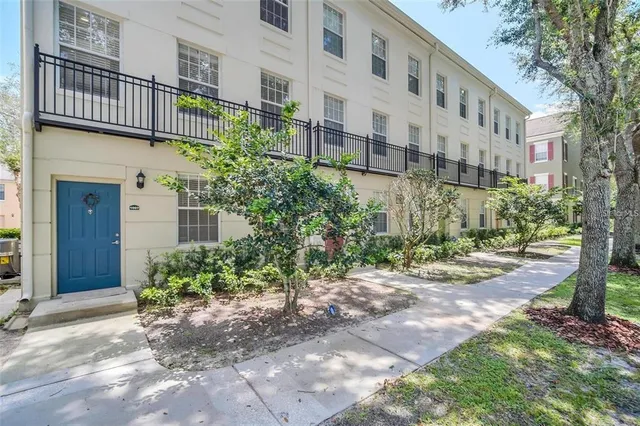 a view of a building with a yard