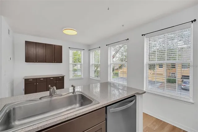 a kitchen with a sink stove and microwave
