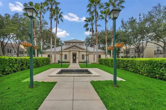 an empty room with windows and ceiling fan