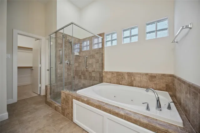 a bathroom with a bathtub and a shower